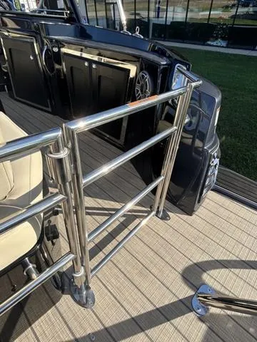 Slide: The Image of 2024 Sylvan M3 DLZ boat interior with stainless steel railing and beige seating. - 48