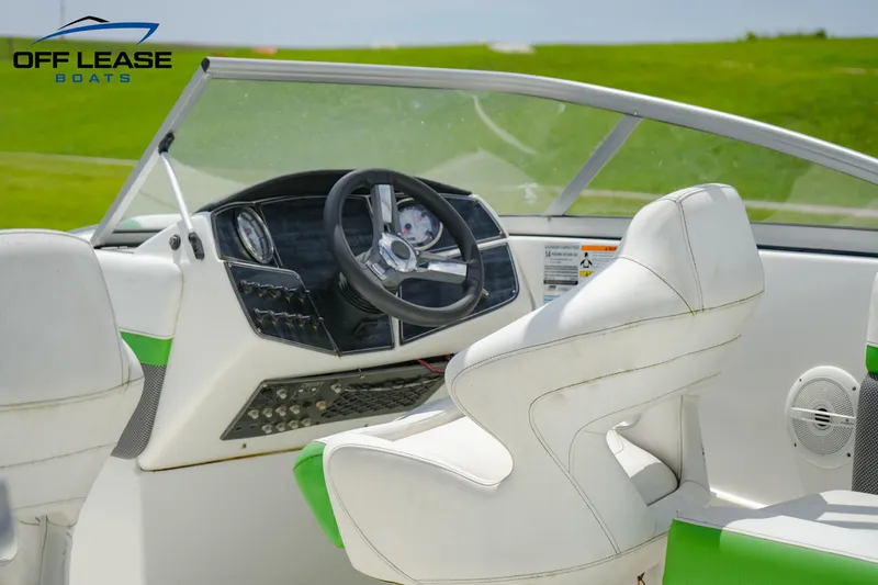 Slide: The Image of 2020 Hurricane 217 SD boat interior with steering wheel and dashboard. - 9
