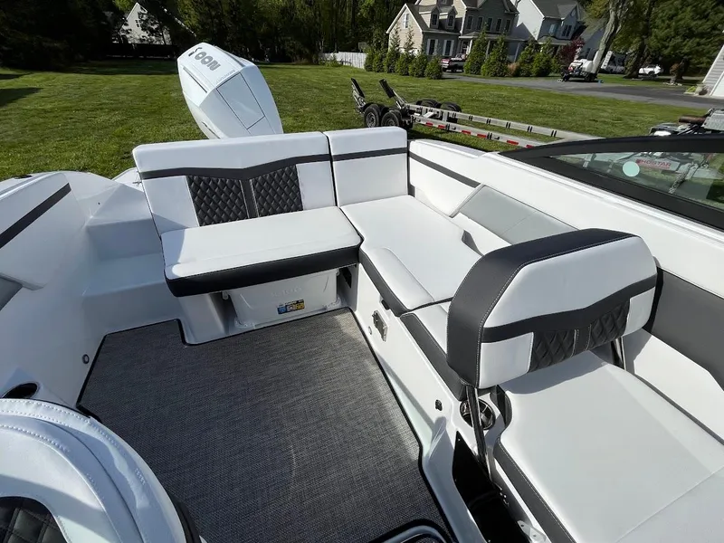 Slide: The Image of 2024 Monterey M-205 boat interior with white and black seating. - 11