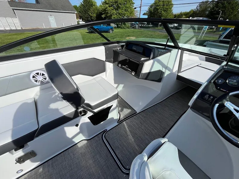 Slide: The Image of 2024 Monterey M-205 boat interior with modern seating and dashboard. - 13
