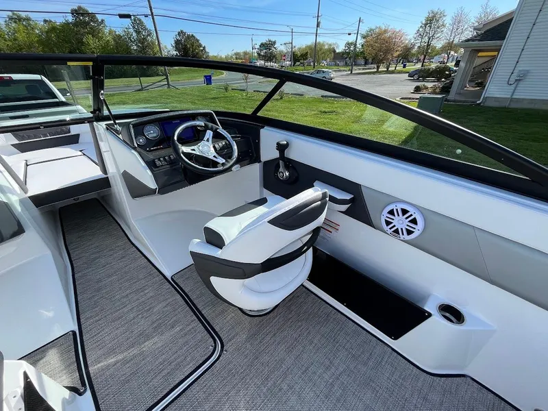 Slide: The Image of 2024 Monterey M-205 boat interior with modern dashboard and comfortable seating. - 14