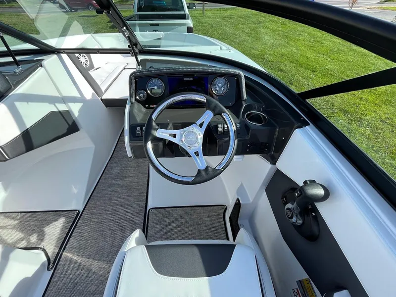 Slide: The Image of 2024 Monterey M-205 boat interior with steering wheel and dashboard. - 15