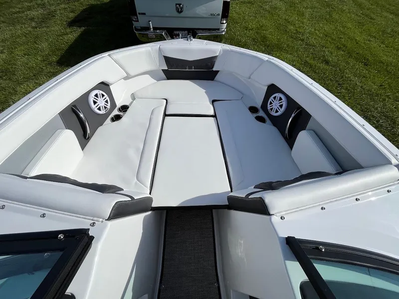 Slide: The Image of 2024 Monterey M-205 boat interior with white seating and built-in speakers. - 18