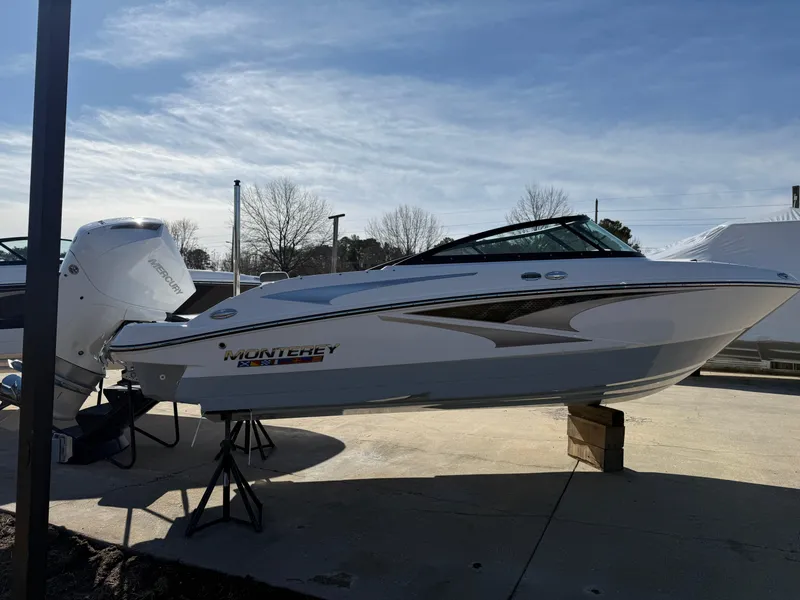 Slide: The Image of 2024 Monterey M-205 boat displayed outdoors on a sunny day. - 3