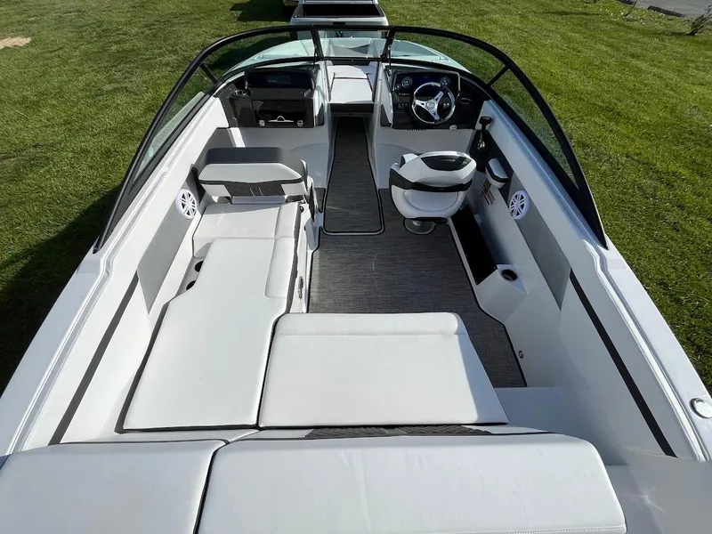 Slide: The Image of 2024 Monterey M-205 boat interior with white seating and modern dashboard. - 8