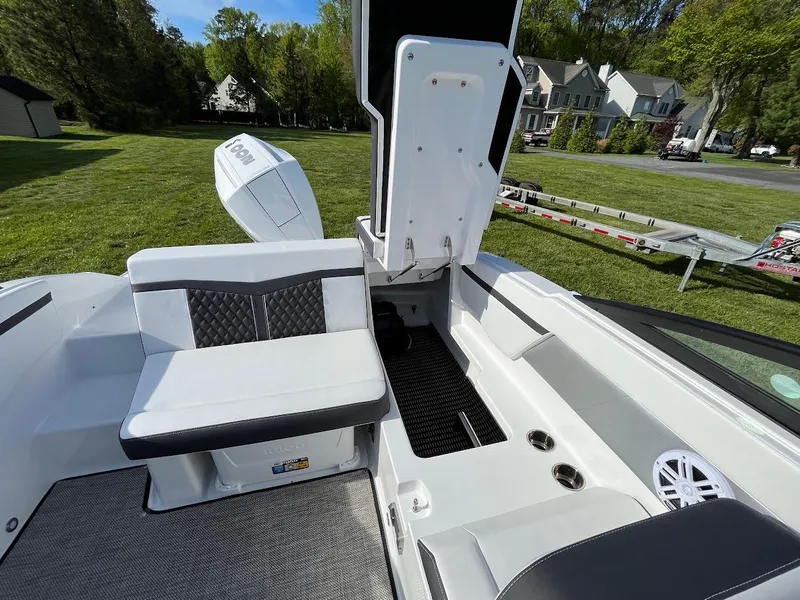 Slide: The Image of 2024 Monterey M-205 boat interior with open storage compartment and seating. - 9