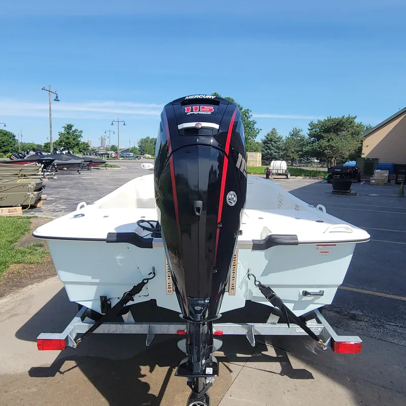 Slide: The Image of 2024 Mako Pro Skiff 19 CC with Mercury 115 outboard motor on trailer. - 3
