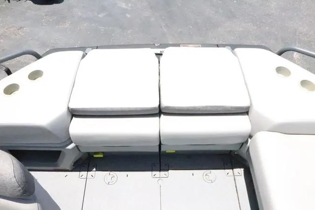 Slide: The Image of 2024 Sea-Doo Switch® Cruise 18 interior seating with cup holders, showcasing comfort and functionality. - 16