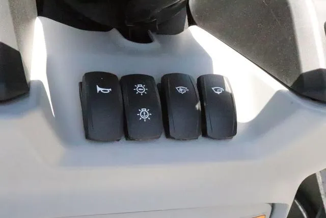 Slide: The Image of Control panel of 2024 Sea-Doo Switch® Cruise 18, featuring various function buttons. - 18