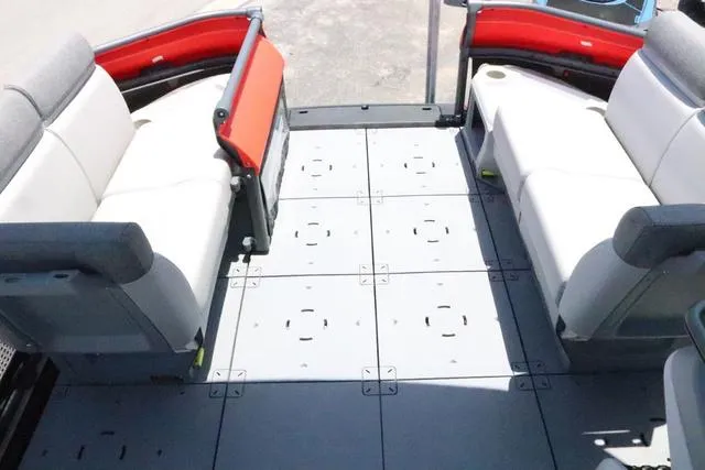 Slide: The Image of 2024 Sea-Doo Switch® Cruise 18 interior with modular seating and spacious deck layout. - 19