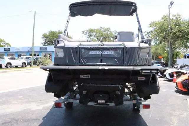 Slide: The Image of 2024 Sea-Doo Switch® Cruise 18 - 230 hp Galvanized, rear view, parked on trailer. - 5