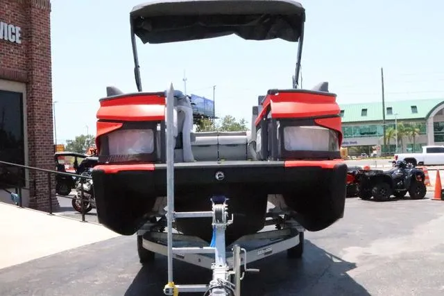Slide: The Image of 2024 Sea-Doo Switch® Cruise 18 on trailer, rear view, parked outdoors. - 9