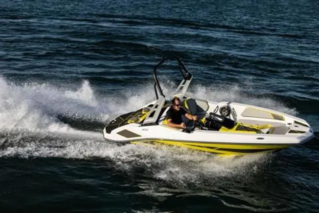 Slide: The Image of 2023 Scarab 165 ID jet boat speeding on open water. - 11