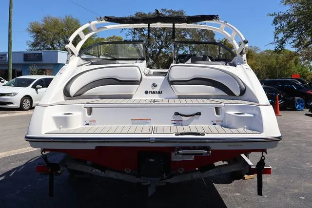 Slide: The Image of 2024 Yamaha AR195 boat interior with storage compartment and steering wheel. - 5