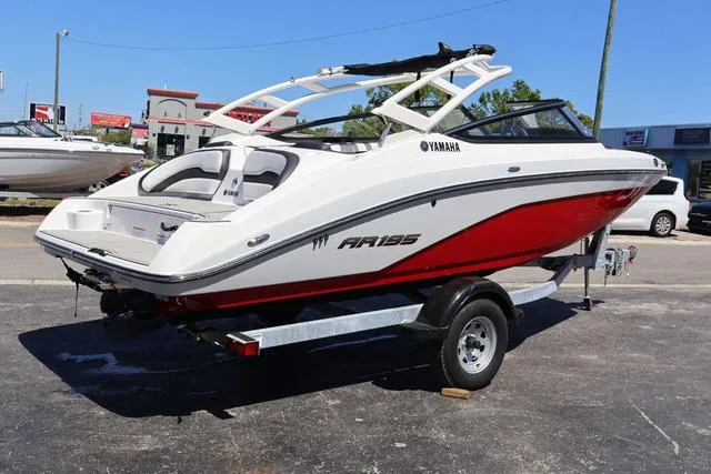 Slide: The Image of 2024 Yamaha AR195 boat dashboard with steering wheel and control panel. - 6