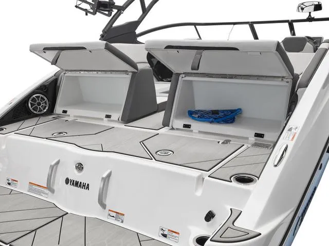 Slide: The Image of 2024 Yamaha Boats 252XE-MIST GRAY-GALVANIZE with open storage compartments. - 5