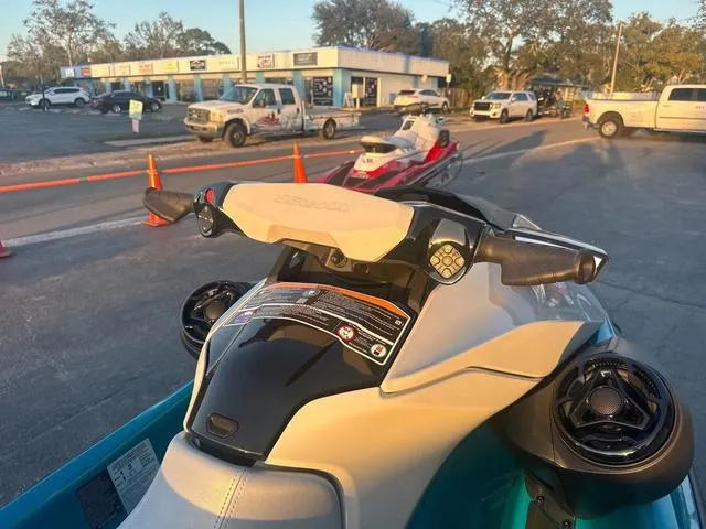 Slide: The Image of 2024 Sea-Doo Waverunner GTI SE 170 with audio system, parked outdoors. - 8