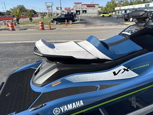 Slide: The Image of 2024 Yamaha Marine Waverunner VX Cruiser in deepwater blue, parked outdoors. - 10