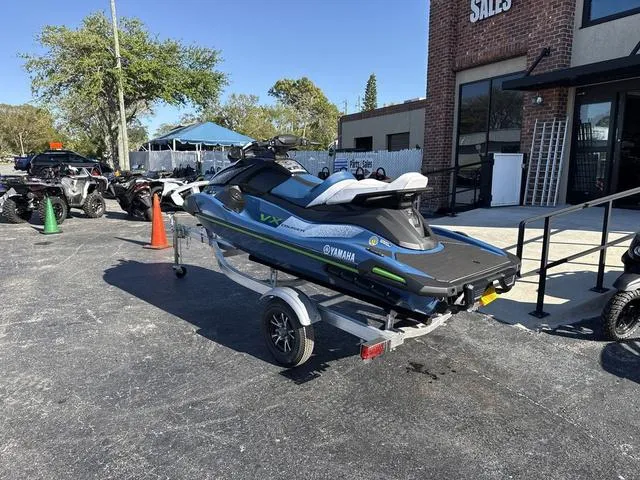 Slide: The Image of 2024 Yamaha Marine Waverunner VX Cruiser in Deepwater Blue with open storage compartment. - 5