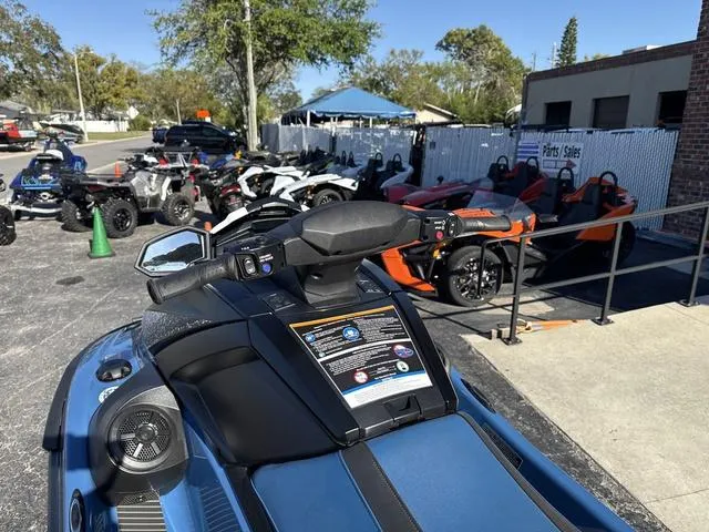 Slide: The Image of 2024 Yamaha Marine Waverunner VX Cruiser in deepwater blue at dealership lot. - 8
