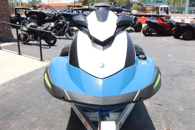 Slide: The Image of 2024 Yamaha Marine Waverunner VX Cruiser with audio, blue and white, parked outdoors. - 10