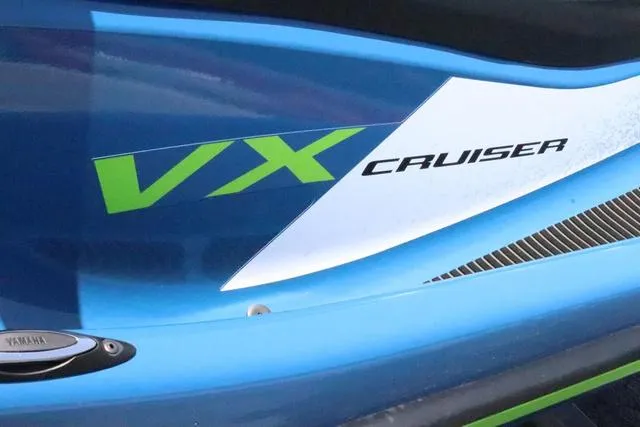 Slide: The Image of 2024 Yamaha Marine Waverunner VX Cruiser, blue with green accents, close-up view. - 11