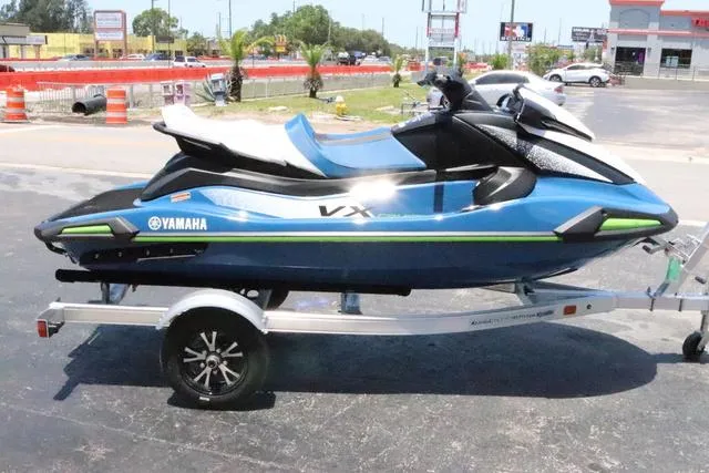 Slide: The Image of 2024 Yamaha Marine Waverunner VX Cruiser storage compartment with sunscreen bottle. - 8
