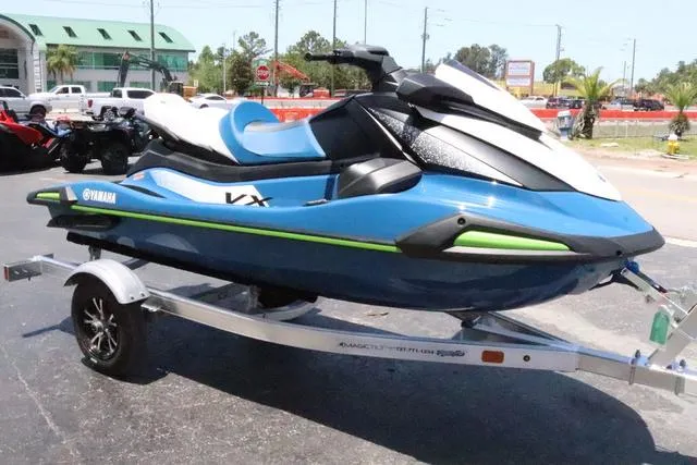 Slide: The Image of 2024 Yamaha Marine Waverunner VX Cruiser with audio, blue and white, on a trailer. - 9