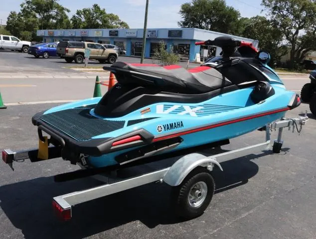 Slide: The Image of 2024 Yamaha Marine Waverunner VX Deluxe with audio system, cyan color, close-up view. - 5