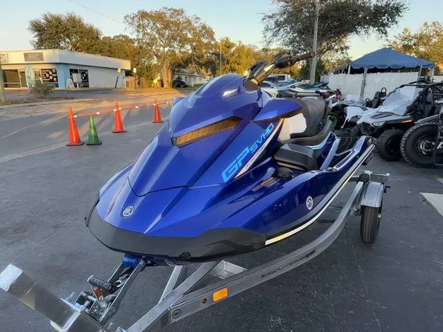 Slide: The Image of 2024 Yamaha Marine Waverunner GP SVHO in blue on trailer, parked outdoors. - 4
