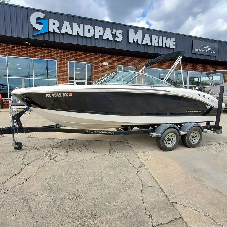 The Image of 2014 Chaparral 21 Sport boat on trailer at Grandpa's Marine dealership. - 1