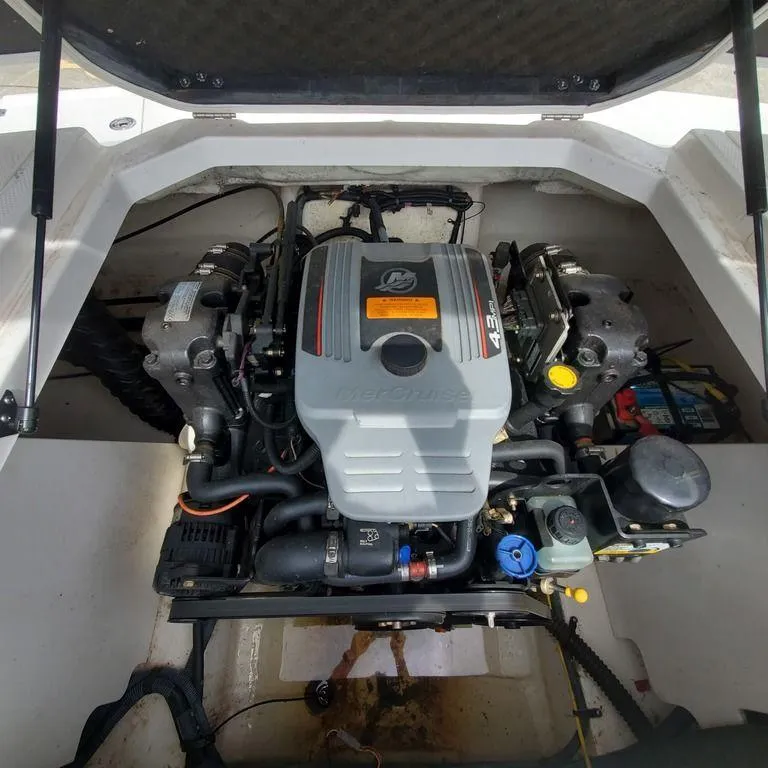 Slide: The Image of 2014 Chaparral 21 Sport boat engine compartment with MerCruiser 4.3L engine. - 6