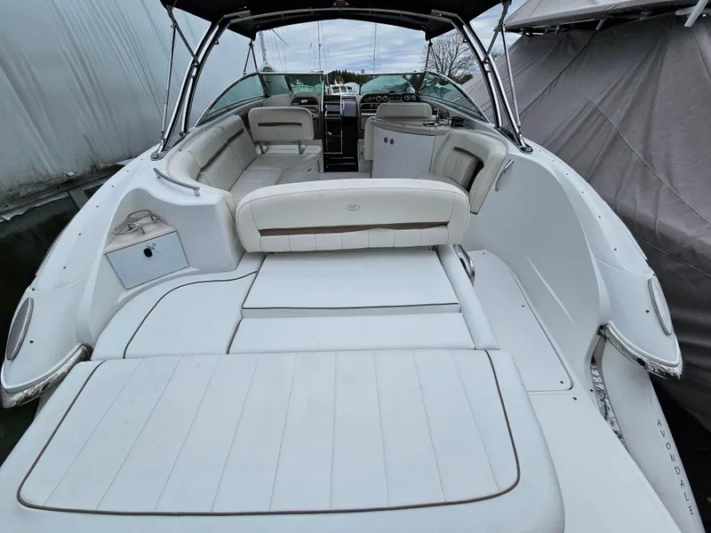 Slide: The Image of 2007 Cobalt 323 boat with spacious white leather seating and sun deck. - 2