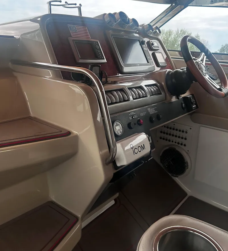Slide: The Image of 2009 Formula 400 Super Sport boat cockpit with navigation controls and steering wheel. - 16