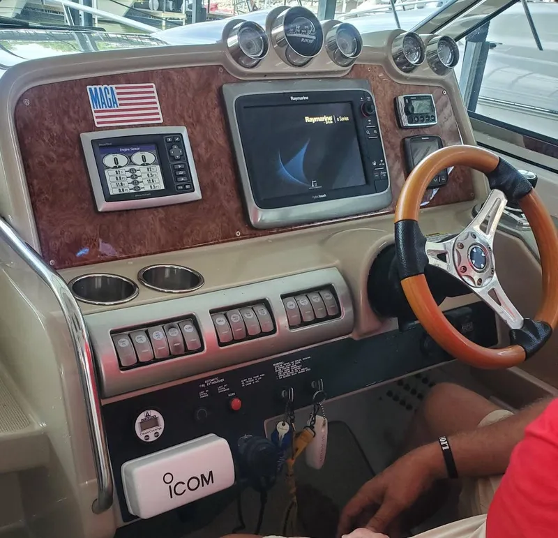 Slide: The Image of 2009 Formula 400 Super Sport boat dashboard with navigation system and controls. - 17