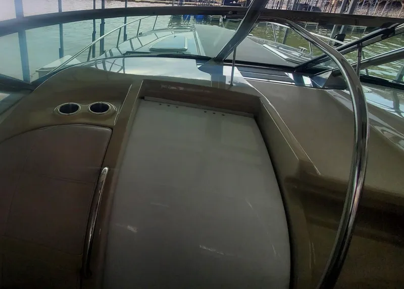 Slide: The Image of 2009 Formula 400 Super Sport boat interior with windshield and cup holders. - 19