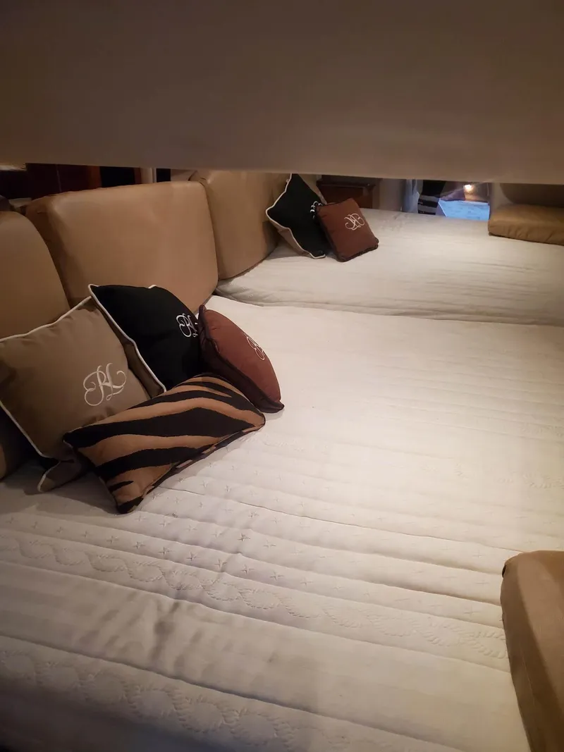 Slide: The Image of Interior cabin of 2009 Formula 400 Super Sport with plush bedding and decorative pillows. - 23