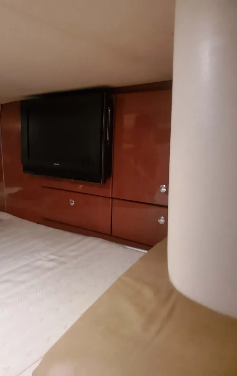 Slide: The Image of Interior cabin of 2009 Formula 400 Super Sport with TV and wooden cabinets. - 24