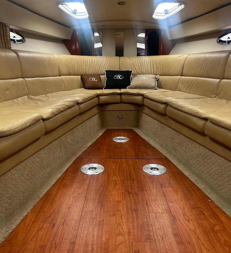 Slide: The Image of Luxurious interior of a 2009 Formula 400 Super Sport boat with leather seating and wood flooring. - 25