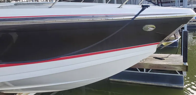 Slide: The Image of 2009 Formula 400 Super Sport boat docked at marina. - 4