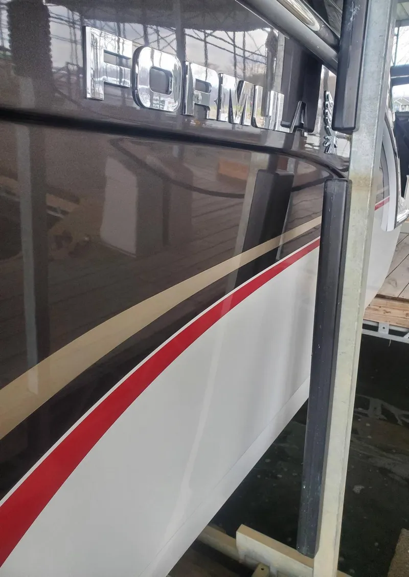 Slide: The Image of 2009 Formula 400 Super Sport boat in storage. - 7