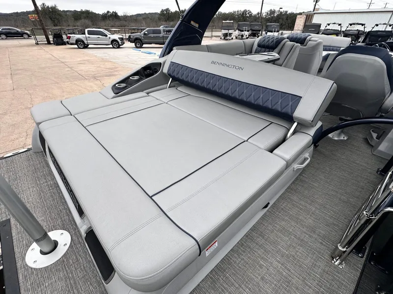 Slide: The Image of 2024 Bennington 23 RXSBA boat with luxurious seating and modern design. - 16