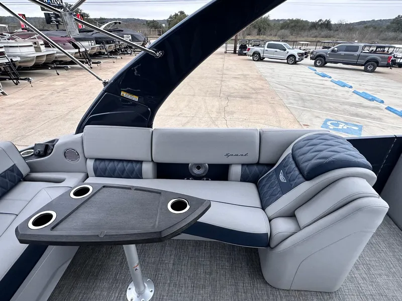 Slide: The Image of 2024 Bennington 23 RXSBA boat interior with seating and table, showcasing luxury design. - 19