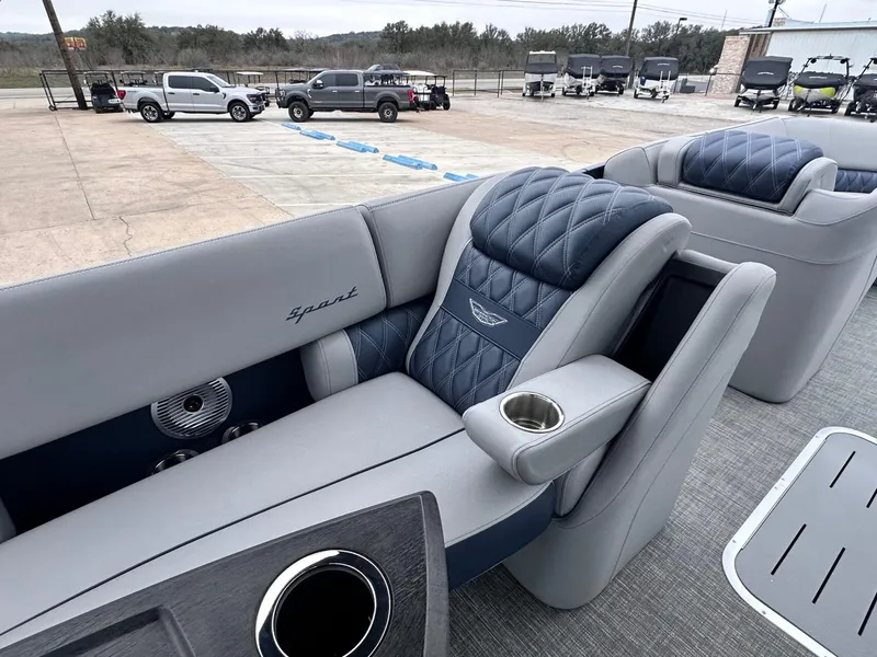 Slide: The Image of 2024 Bennington 23 RXSBA boat interior with luxurious seating and cup holders. - 20