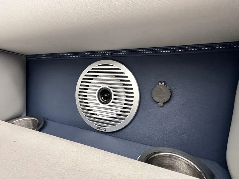 Slide: The Image of 2024 Bennington 23 RXSBA boat interior with Kicker speaker and cup holders. - 29