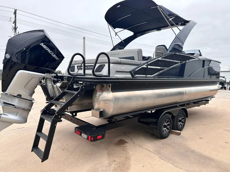 Slide: The Image of 2024 Bennington 23 RXSBA pontoon boat with Mercury engine on trailer. - 5