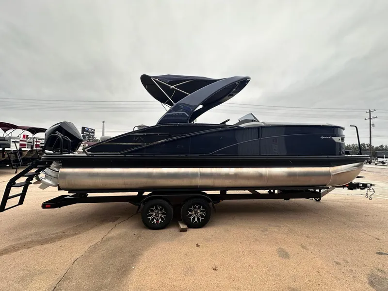 Slide: The Image of 2024 Bennington 23 RXSBA pontoon boat on trailer, side view. - 6