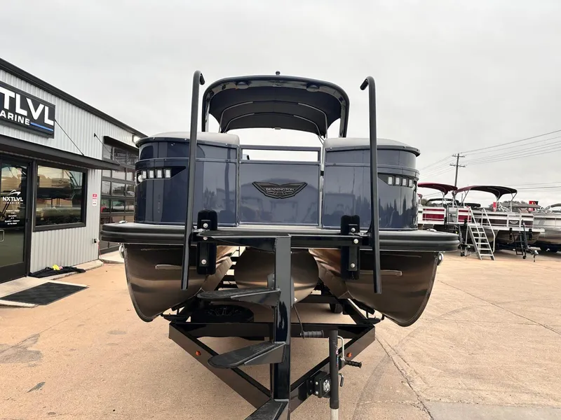 Slide: The Image of 2024 Bennington 23 RXSBA pontoon boat on trailer at dealership. - 8