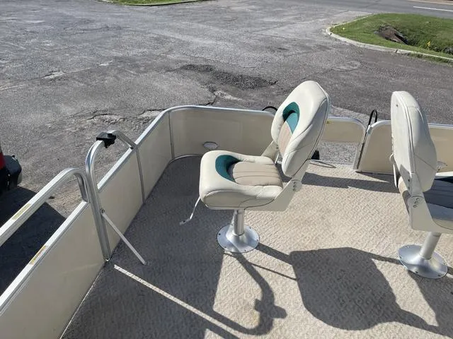 Slide: The Image of 2006 Godfrey Parti Kraft 1980F pontoon boat with two swivel seats. - 11