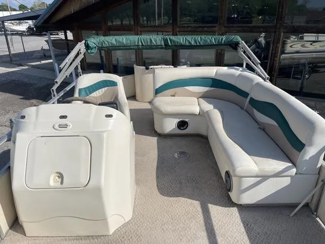 Slide: The Image of 2006 Godfrey Parti Kraft 1980F pontoon boat with white and teal seating. - 5